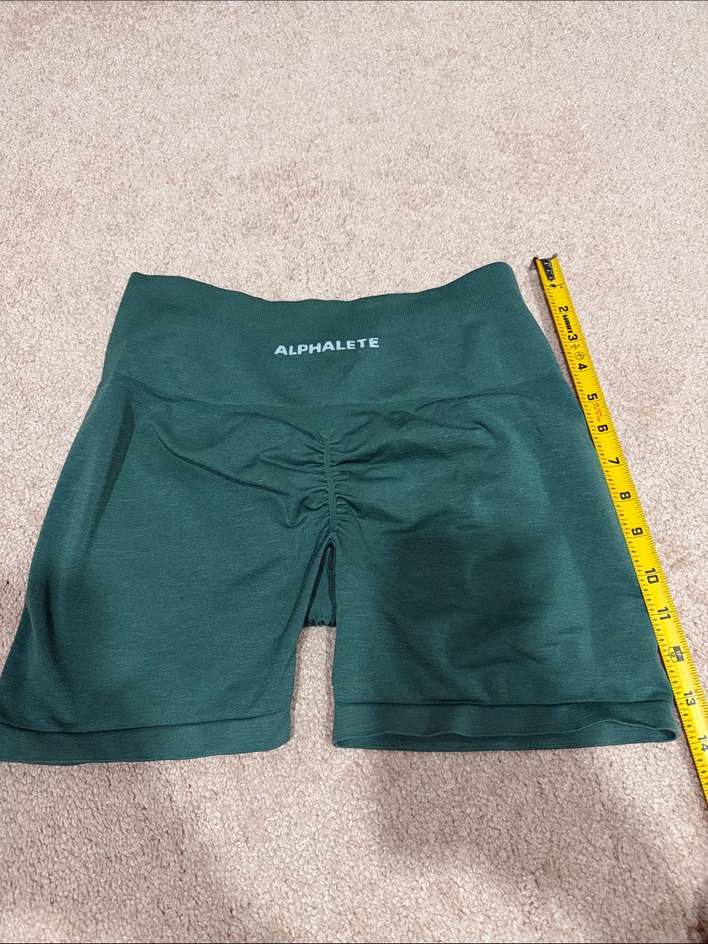 Alphalete High-Rise Scrunch Shorts in Green